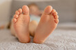 © Creative_Bird - Close-up view of kid's feet. Child foot care, hygiene, correct footwear. Flat feet. Ideal for use in healthcare, pediatrics, and parenting-themed projects or advertisements. Foot problems, pain.
