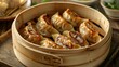 © Aliaksandra - asian food culture, bamboo steamer packed with gyoza dumplings, a popular asian appetizer