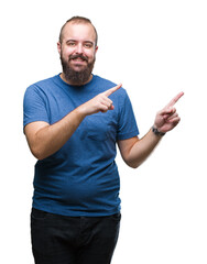 Poster - Young caucasian hipster man over isolated background smiling and looking at the camera pointing with two hands and fingers to the side.