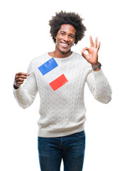 Wall Mural - Afro american man flag of France over isolated background doing ok sign with fingers, excellent symbol