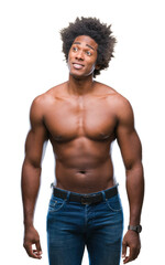 Poster - Afro american shirtless man showing nude body over isolated background smiling looking side and staring away thinking.