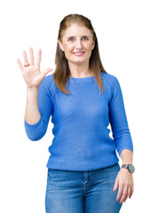 Canvas Print - Beautiful middle age mature woman wearing winter sweater over isolated background showing and pointing up with fingers number five while smiling confident and happy.