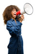 © Krakenimages.com - African american woman wearing blue jumpsuit communicates shouting loud holding a megaphone, expressing success and positive concept, idea for marketing or sales