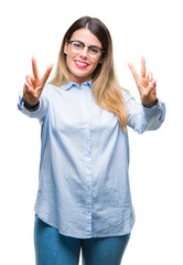 Poster - Young beautiful business woman wearing glasses over isolated background smiling looking to the camera showing fingers doing victory sign. Number two.