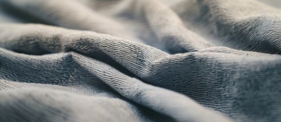 Poster - Close up of a gray cotton fabric with folds ideal as a background or for clothing production with copy space image available