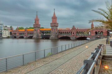 Wall Mural - Old Berlin Oberbaum Bridge over the Spree River at sunset.