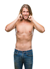 Poster - Young handsome shirtless man with long hair showing sexy body over isolated background covering ears with fingers with annoyed expression for the noise of loud music. Deaf concept.