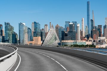 Wall Mural - Empty urban asphalt road exterior with city buildings background. New modern highway concrete construction. Concept of way to success. Transportation logistic industry fast delivery. New York. USA.