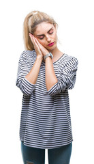 Poster - Young beautiful blonde woman wearing stripes sweater over isolated background sleeping tired dreaming and posing with hands together while smiling with closed eyes.