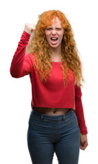 Sticker - Young redhead woman annoyed and frustrated shouting with anger, crazy and yelling with raised hand, anger concept