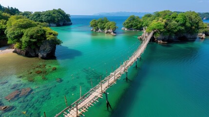 Suspension bridge spanning over clear turquoise water, connecting lush green islands, creating a picturesque and serene tropical landscape perfect for travel promotions.