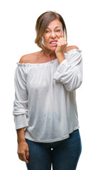 Sticker - Middle age senior hispanic woman over isolated background looking stressed and nervous with hands on mouth biting nails. Anxiety problem.