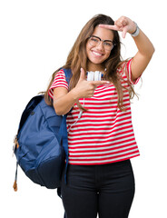 Poster - Young beautiful brunette student woman wearing headphones and backpack over isolated background smiling making frame with hands and fingers with happy face. Creativity and photography concept.