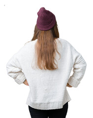 Sticker - Young beautiful brunette hipster woman wearing glasses and winter hat over isolated background standing backwards looking away with arms on body