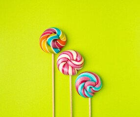 Wall Mural - Color lollipop, spiral candy on stick, colorful striped lollypop, round fruit caramel, circle lollipop