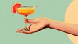 © Катя О - Hand Offering a Cocktail With a Grapefruit Garnish on a Green and Yellow Background