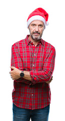 Poster - Middle age hoary senior man wearing christmas hat over isolated background with serious expression on face. Simple and natural looking at the camera.