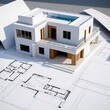 © Nopadol - Modern Architecture Blueprint: A sleek, contemporary home design with a rooftop pool sits atop a blueprint, showcasing the meticulous planning and artistry of modern architecture.