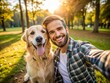 © Sirinporn - Selfie picture of a young happy man walking his dog in a park , smiling guy and pet having fun together outdoor , friendship and love between humans and animals