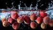 © anantachat - Whole lychees dropping into water creating vibrant splashes and ripples against a white background Stock Photo with copy space