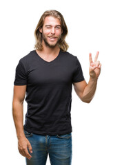 Poster - Young handsome man with long hair over isolated background smiling with happy face winking at the camera doing victory sign. Number two.