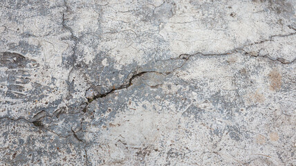 Poster - Close up image of cracked concrete surface texture, perfect for design background. Cracked Concrete Wall Texture Material