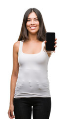 Poster - Young beautiful hispanic showing smartphone with a happy face standing and smiling with a confident smile showing teeth