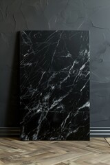 Poster - Black marble countertop with textured surface on gray wall. Wooden floor complements cool marble hue. Perfect background for modern interior design, home decor, or minimalist aesthetic.