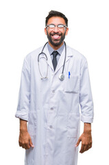 Sticker - Adult hispanic doctor man over isolated background sticking tongue out happy with funny expression. Emotion concept.