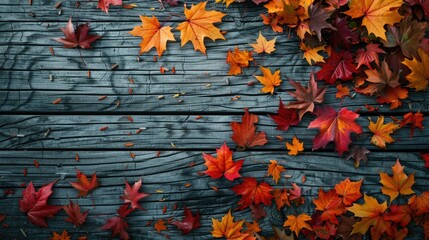 Wall Mural - Colorful maple leaves in autumn with space for text on wooden backdrop