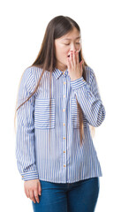 Wall Mural - Young Chinese woman over isolated background bored yawning tired covering mouth with hand. Restless and sleepiness.