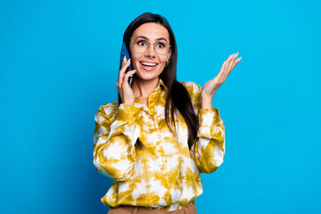 Poster - Photo of gorgeous lovely woman wear stylish clothes speak phone isolated on blue color background