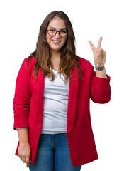 Wall Mural - Beautiful plus size young business woman wearing elegant jacket and glasses over isolated background smiling with happy face winking at the camera doing victory sign. Number two.