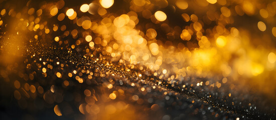 golden background with bokeh effect; widescreen backdrop; shiny glamour gold surface with darker bottom at an angle