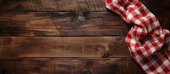 Poster - Top down view of a checkered tablecloth on a wooden table with ample copy space for text in the image