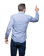 Poster - Young handsome man over isolated background Posing backwards pointing behind with finger hand