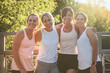 © Louis-Paul Photo - females in sportswear jogging together bright sunny park in summer