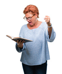 Poster - Senior caucasian woman reading a book over isolated background annoyed and frustrated shouting with anger, crazy and yelling with raised hand, anger concept