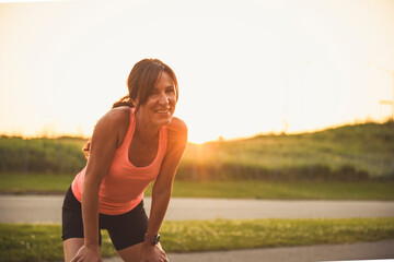 great sporty woman jogging outdoors on sunset time