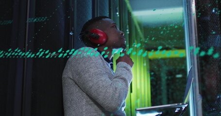 Poster - Image of data processing on thoughtful african american male engineer with laptop at server room
