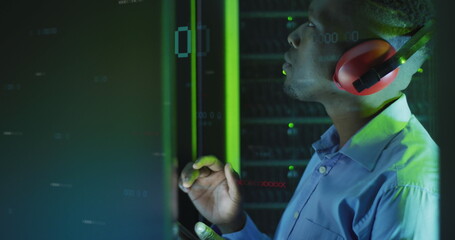 Poster - Image of binary coding over african american male engineer using digital tablet at server room