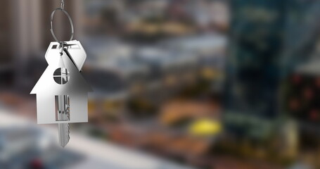 Poster - Image of hanging silver house keys against blurred view of cityscape with copy space