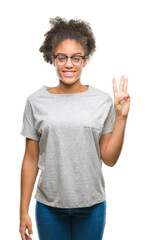 Canvas Print - Young afro american woman wearing glasses over isolated background showing and pointing up with fingers number three while smiling confident and happy.