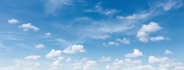 Wall Mural - sky is blue and full of clouds. The clouds are scattered throughout the sky