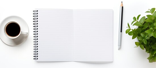 Poster - Top view of a white office desk featuring a blank notebook, computer, supplies, and a coffee cup, suitable for adding text or images