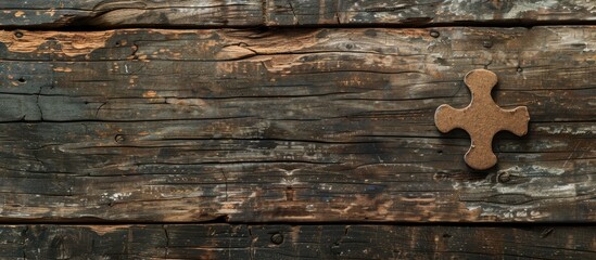 Aufkleber - Weathered grunge textured wood background with a brown blank cardboard puzzle piece for a mock-up with copy space image.