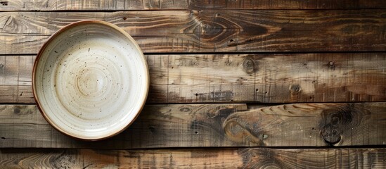 Aufkleber - Wooden table with an empty plate, showcasing a copy space image.