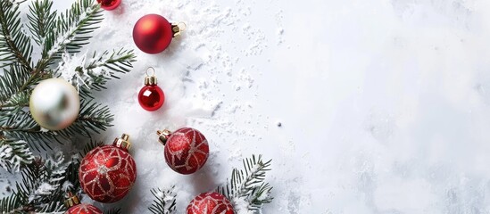 Aufkleber - Snowy white background featuring Christmas ornaments, an evergreen branch, and abundant copy space image.
