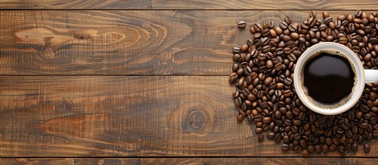 Aufkleber - Top view of coffee cup and coffee beans arranged on a wooden background, providing a visually appealing copy space image.