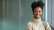 © DARIKA - African businessperson smiling while discussing a project in a modern office representing professional success and confidence Portrait, Realistic Photo, High resolution, Half-body picture, Minimalism,